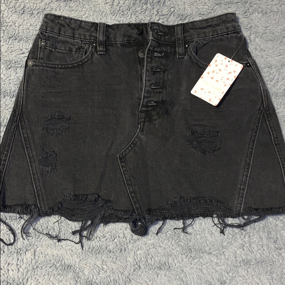 Distressed black denim skirt